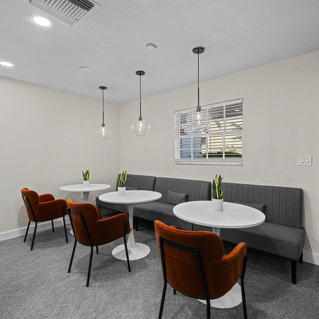The Park at Positano - Living Area with Three White Table